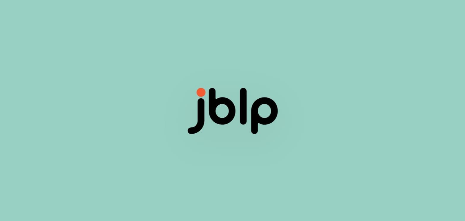jblp.me's cinematic logo entrance animation, caught mid-orbit with a soft pulsing glow around the mark